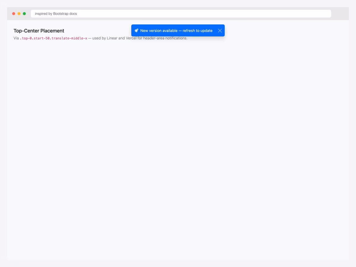 Top-center placement demo — blue primary toast centered along the top edge with "New version available — refresh to update" message